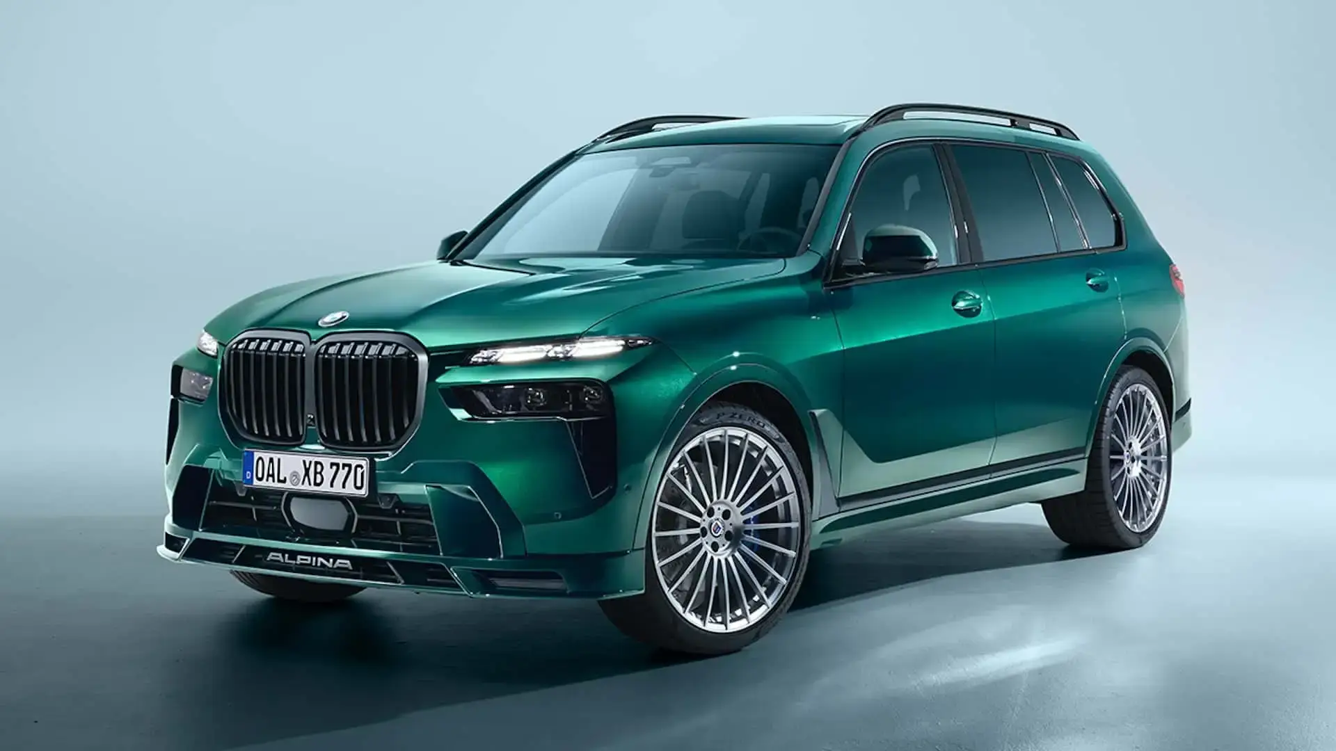 Green Alpina XB7 based on the BMW X7, shown in a clean studio setting with large Alpina wheels and signature front design
