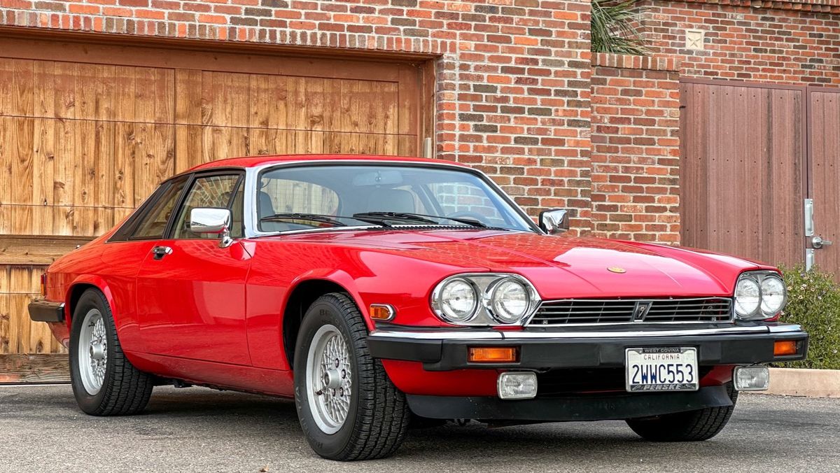 Jaguar XJ-S grand tourer showing signature flying buttresses and long hood profile.